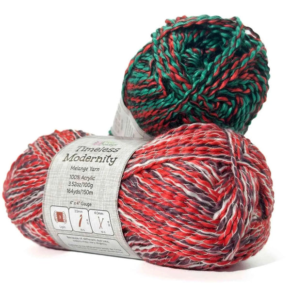 Two balls of red and green yarn with a label on a white background